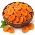 Wooden bowl filled with dried apricots on a white background